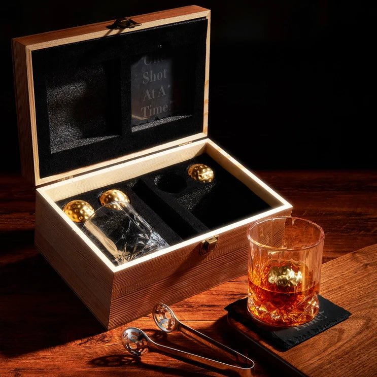 Average Golfer Whiskey Gift Set with golf ball-shaped whiskey stones, glasses, and coasters.