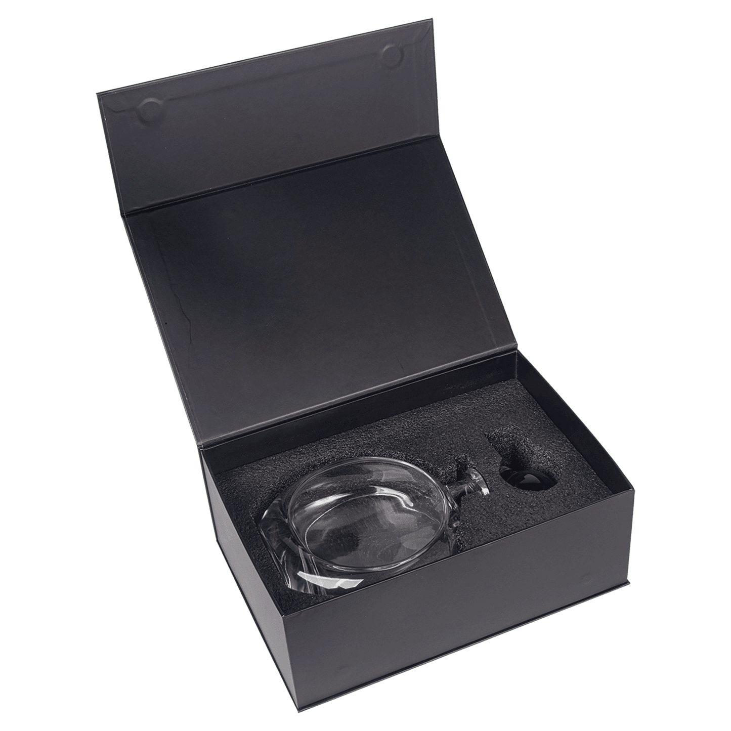 Black gift box open to reveal crystal decanter nestled in charcoal foam packaging with protective insert compartments visible