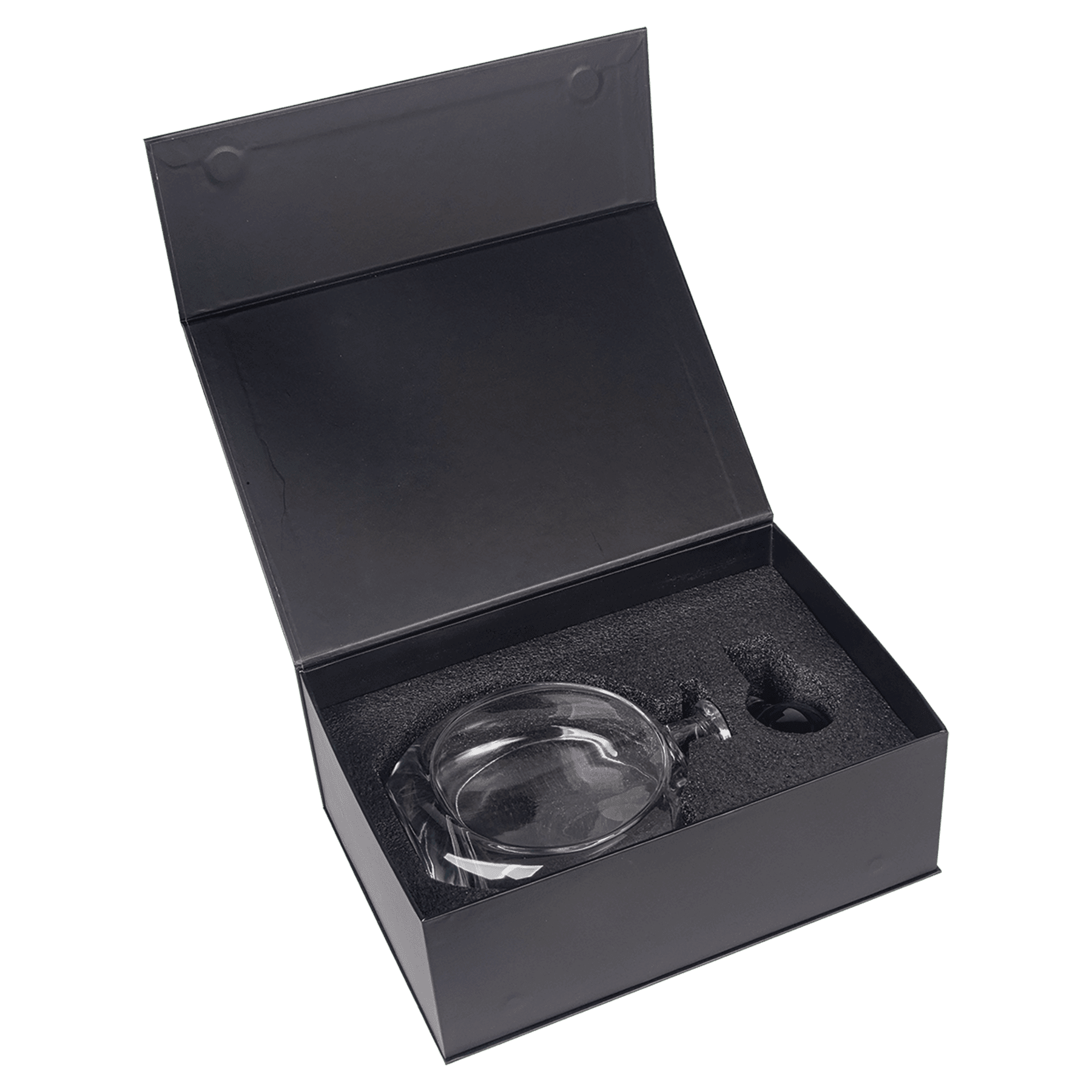 Black gift box open to reveal crystal decanter nestled in charcoal foam packaging with protective insert compartments visible
