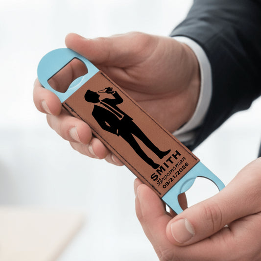 Hand holding a personalized bottle opener with a design and text on a light blue background