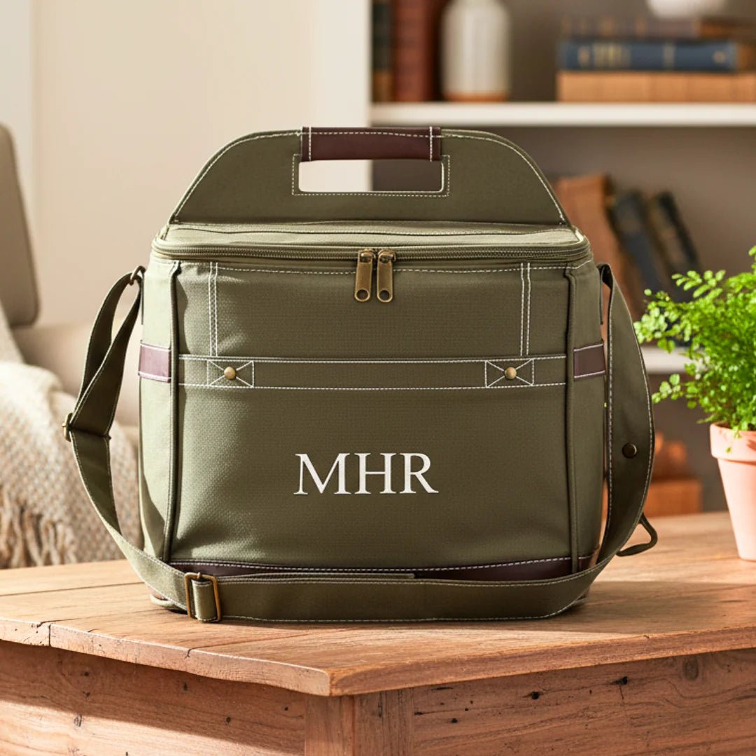 Green cooler bag with 'MHR' monogram on a wooden table