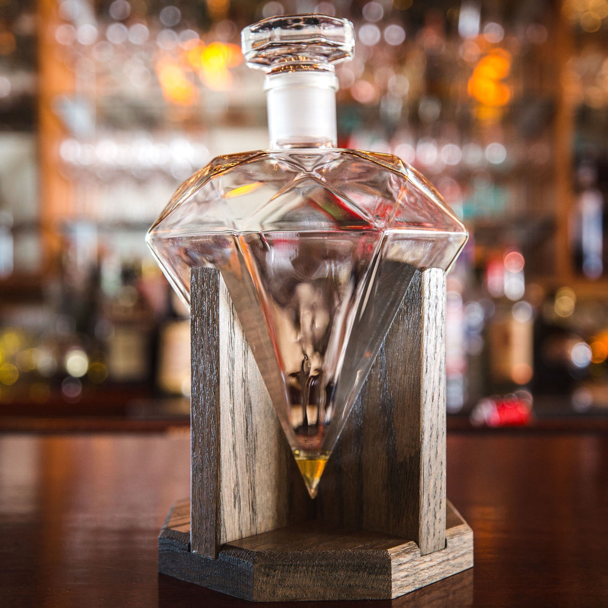 Diamond-shaped whiskey decanter with personalized mahogany stand