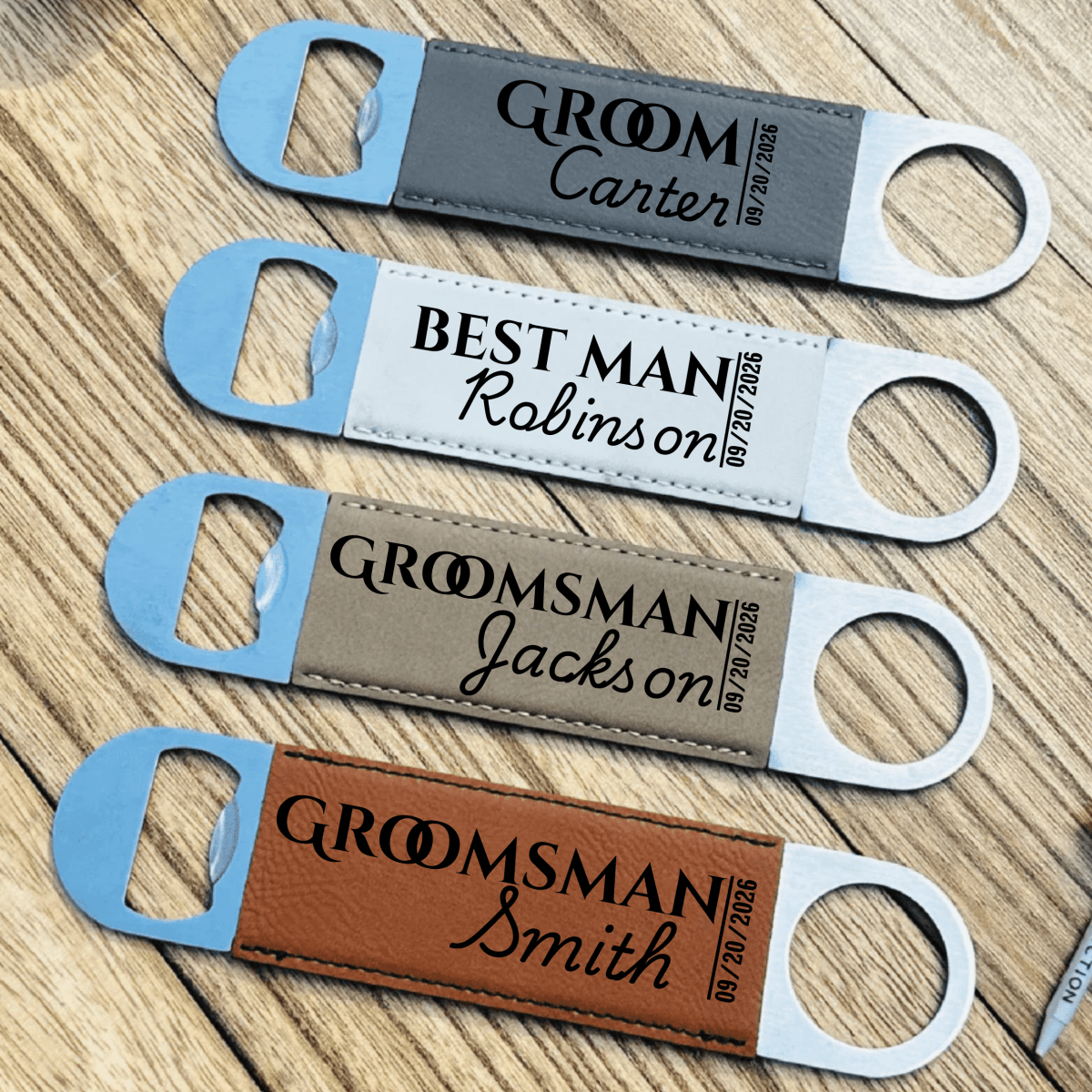 Four personalized bottle openers with names on a wooden surface