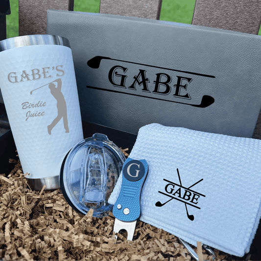 Golf-themed gift set with 'Gabe' branding on a textured surface.