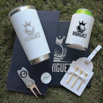 Golf gift set with engraved tumbler, can cooler, divot tool, and golf ball marker, all personalized with sample name "Rodriguez
