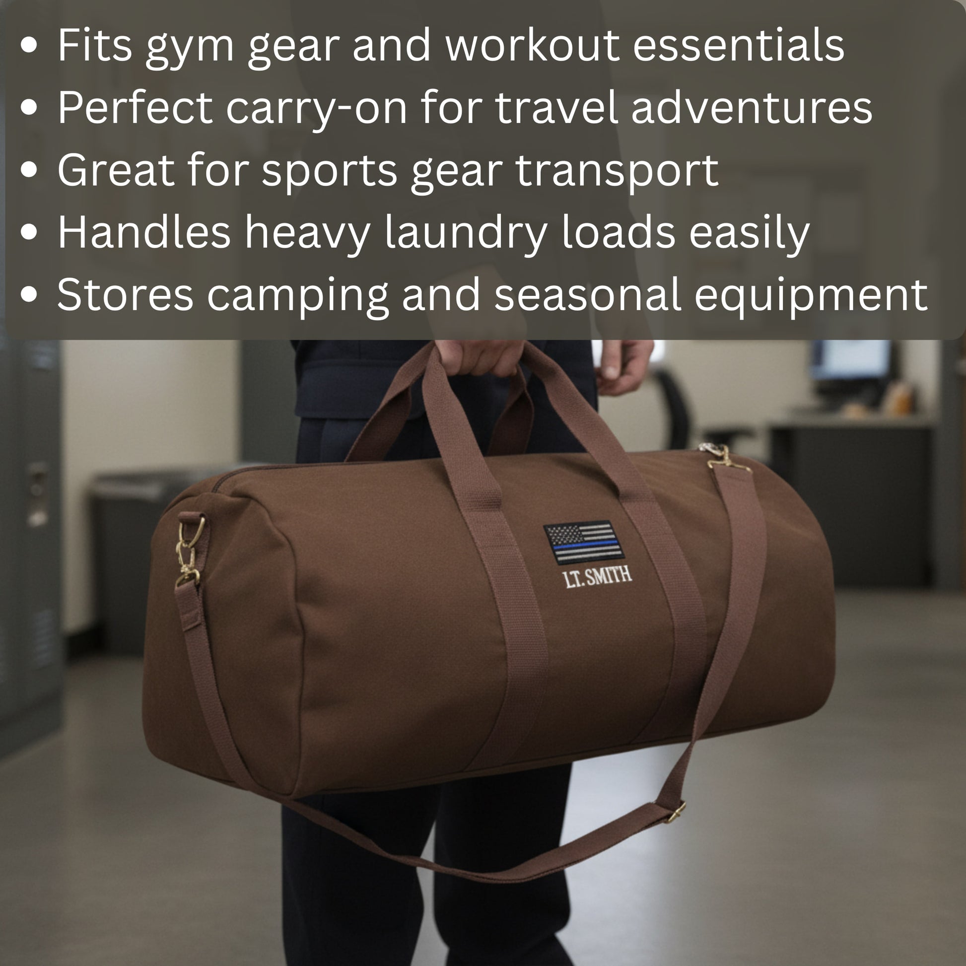 Brown canvas duffle bag with sample personalization reading "LT. SMITH" and thin blue line flag patch, carried by person in indoor setting.