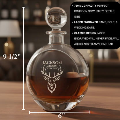 Engraved glass decanter with deer head design and sample personalization reading "Jackson Groom 09/14/2026," filled with amber whiskey, shown with dimensions and sphere stopper.