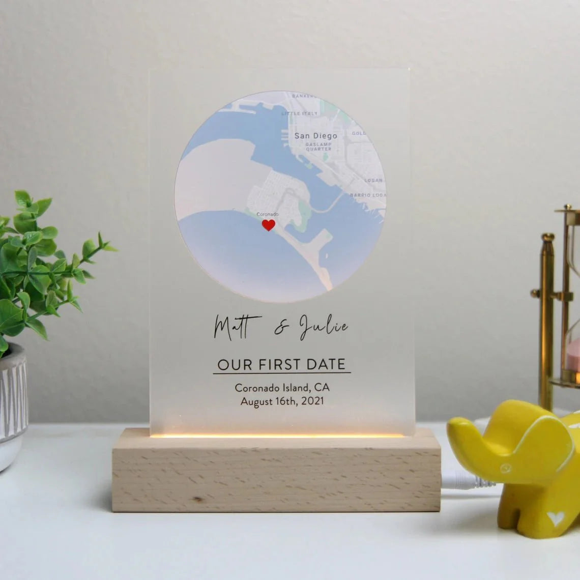 Romantic map sign personalized with custom coordinates, names, and date, available in wood or acrylic with optional LED light stand – perfect for Valentine’s Day, anniversaries, or weddings