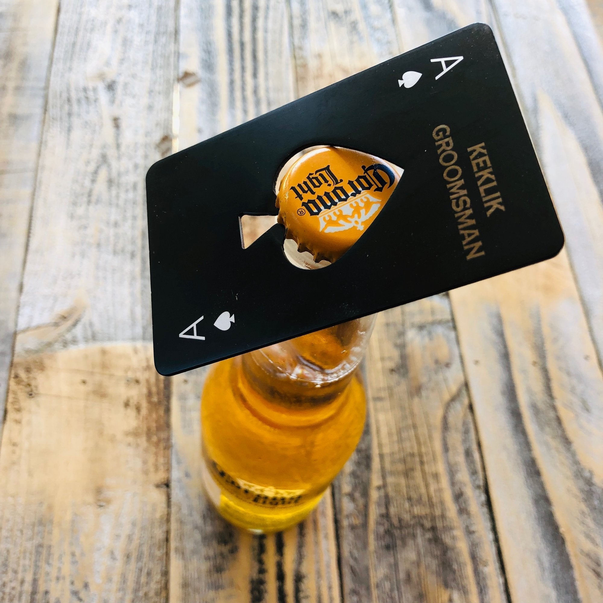 Personalized bottle opener on top of beer bottle