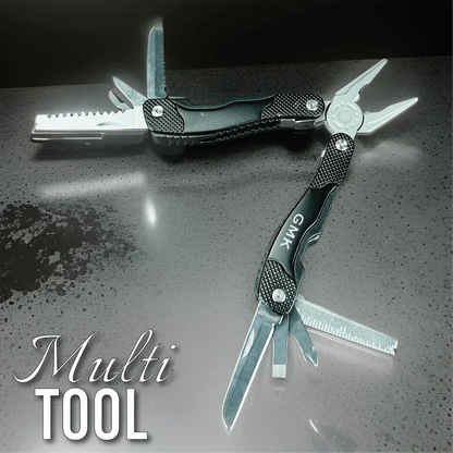 Black and silver multi-tool with textured handle featuring multiple blades, pliers, and tools fully extended on a dark surface