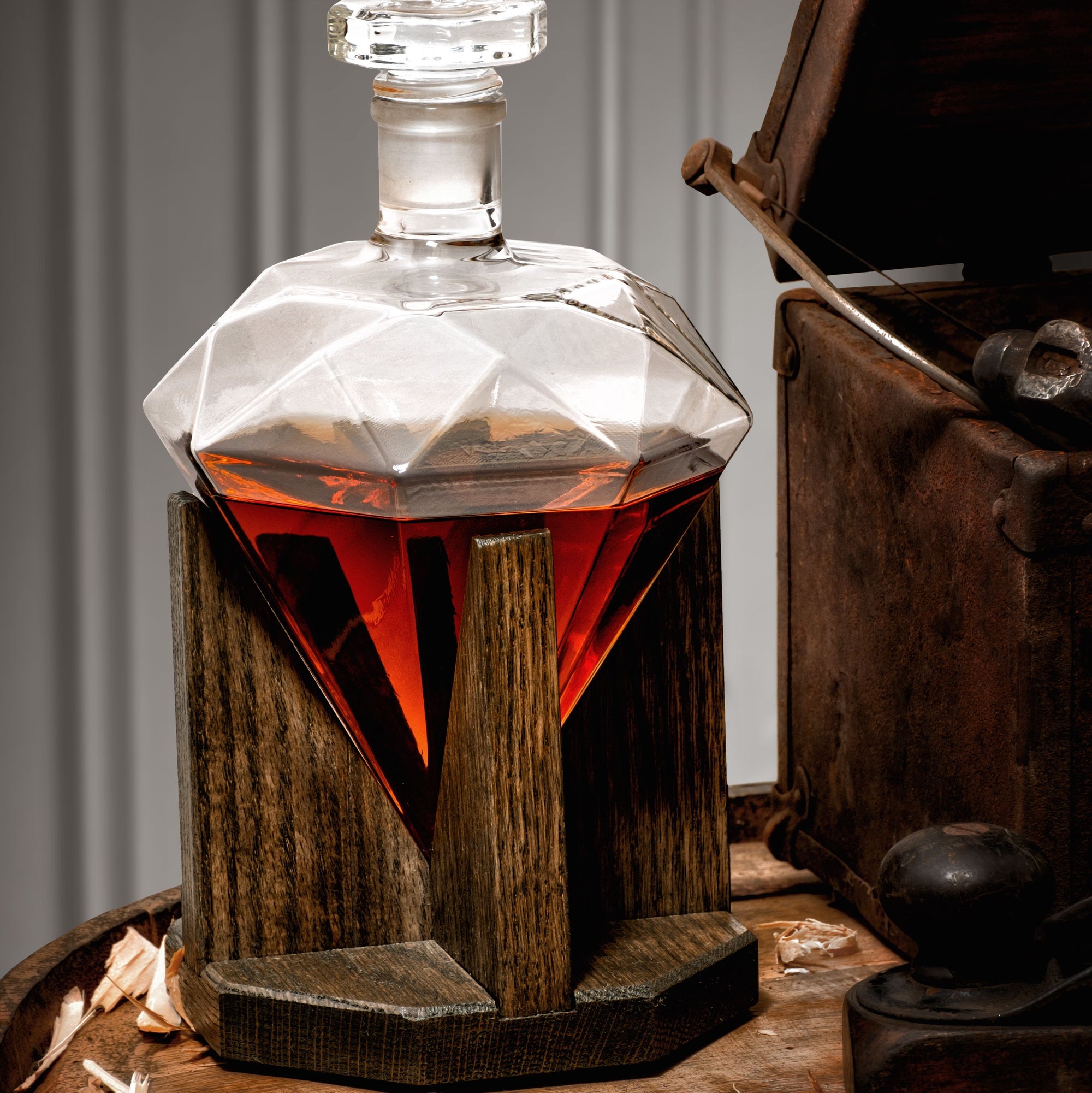 Diamond-shaped whiskey decanter with personalized mahogany stand