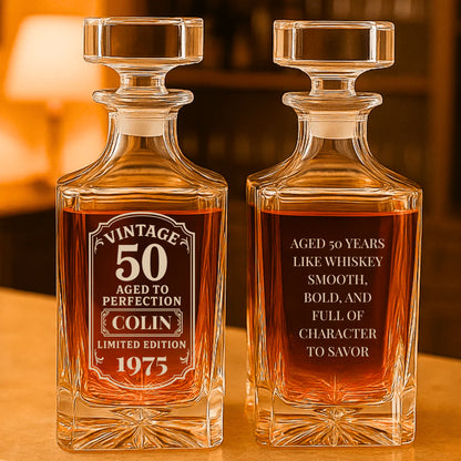 Two vintage whiskey decanters with engraved text on a wooden surface.