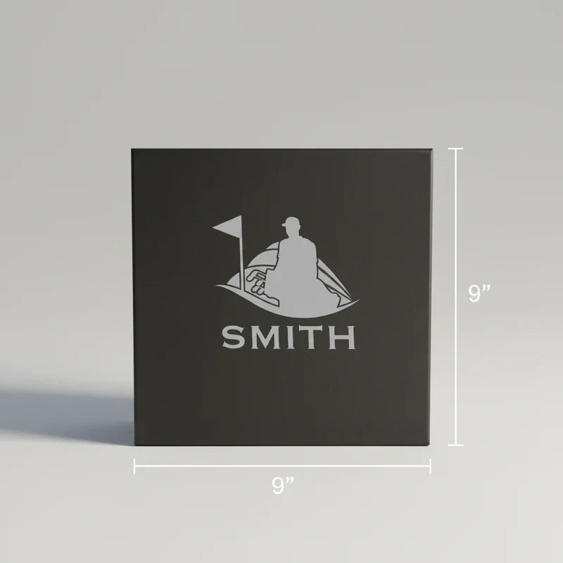 Black square gift box with engraved golf scene and sample name "SMITH," measuring 9 inches on all sides