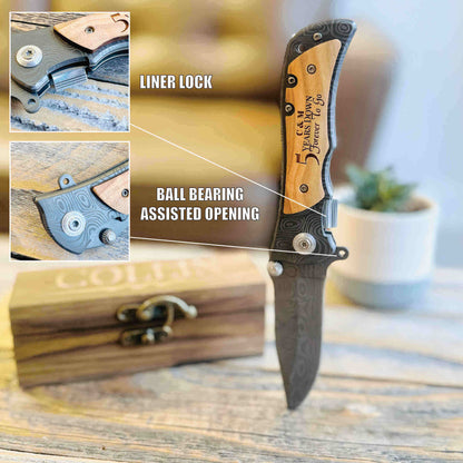 Engraved pocket knife with wood handle featuring liner lock and ball bearing assisted opening mechanism, displayed with detail close-ups and wooden gift box.
