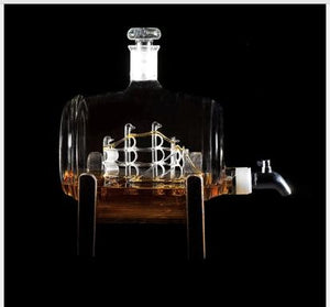 Decanter with ship inside against black background